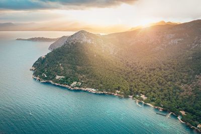 High angle view of bay against sky during sunset