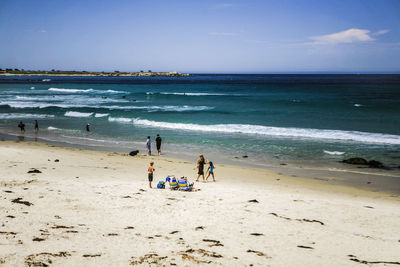 People enjoying at beach