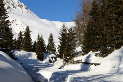 Snow on mountain against clear sky