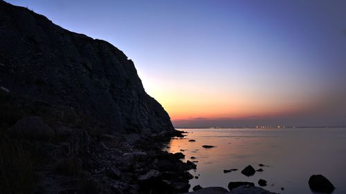 Scenic view of sea against sky at sunset