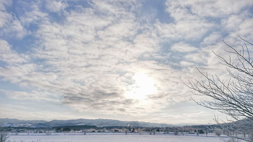 Scenic view of landscape against sky during winter