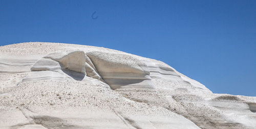 Low angle view of a white rock