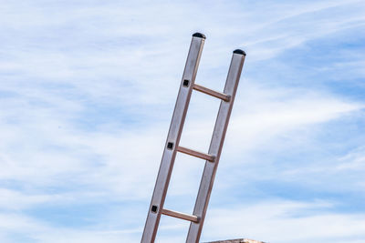 Low angle view of metallic structure against sky