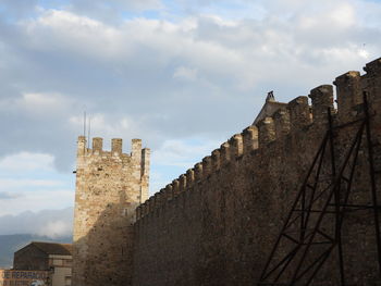 Low angle view of narrow alley amidst buildings in the  medieval city of montblanc