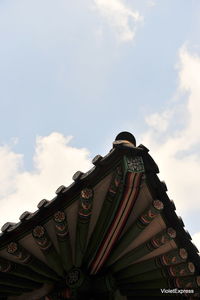 Low angle view of amusement park against sky