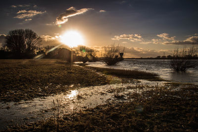 Scenic view of landscape against sky during sunset