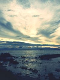 Scenic view of sea against cloudy sky