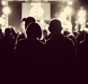 Silhouette people at music concert