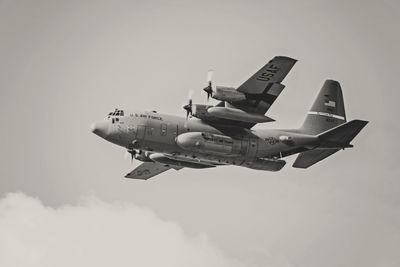 Low angle view of airplane flying in sky