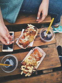 High angle view of man preparing food on table