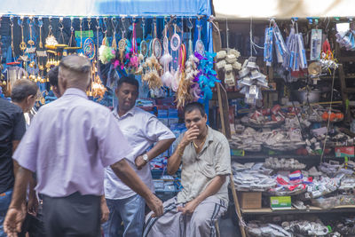 Group of people at market stall