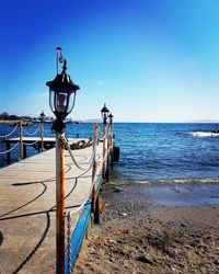 Scenic view of sea against clear blue sky