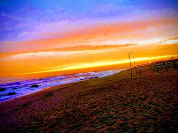 Scenic view of beach against sky during sunset