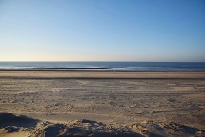 Scenic view of beach against clear sky