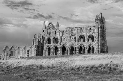 Old ruin against cloudy sky