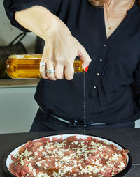 Midsection of man preparing food