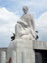Low angle view of statue against sky