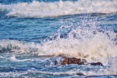 Waves splashing on sea