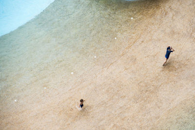 Full length of woman standing in pond