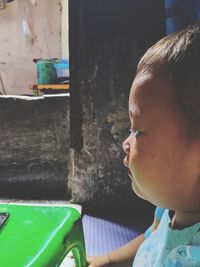 Close-up portrait of boy looking away