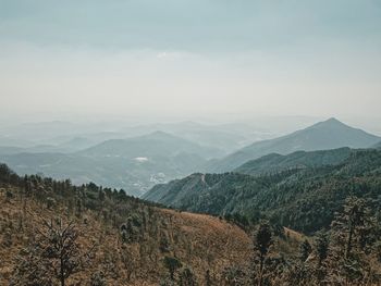 Scenic view of landscape and mountains against sky