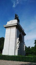 Low angle view of statue against sky