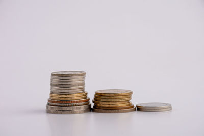 Stack of metal container against white background