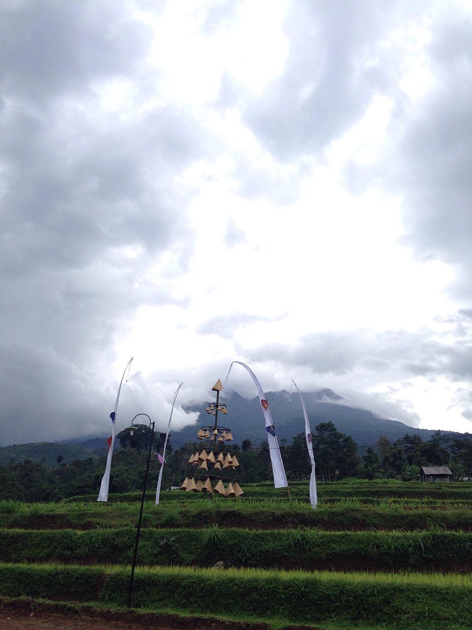 sky, grass, cloud - sky, field, landscape, cloudy, tranquility, tranquil scene, rural scene, nature, scenics, grassy, beauty in nature, green color, agriculture, cloud, growth, non-urban scene, farm, mountain