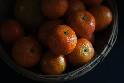 High angle view of orange in basket