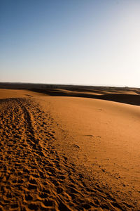 Scenic view of desert against clear sky