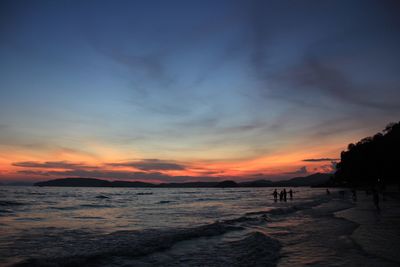 Scenic view of beach against sky during sunset