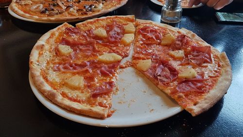 High angle view of pizza in plate on table