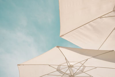 Low angle view of parasol against sky