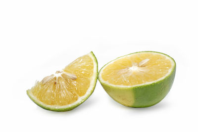 Close-up of fruits against white background