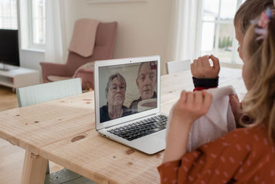 Grandparents talking to their grandchildren on video call