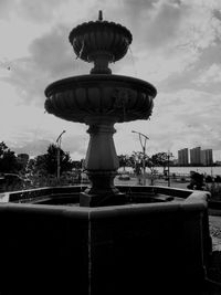 Fountain with buildings in background