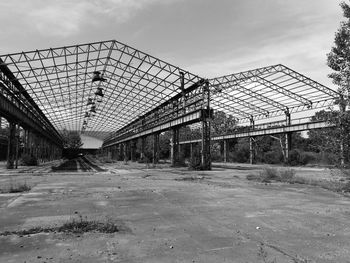 View of abandoned building against cloudy sky