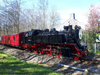 Train on railroad track against sky