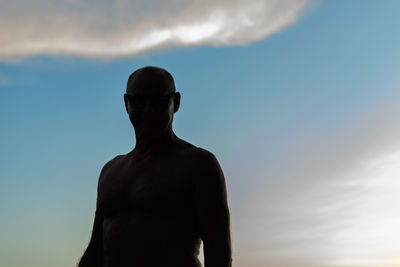 Low angle view of man statue against sky