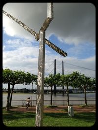 Built structure on landscape against cloudy sky