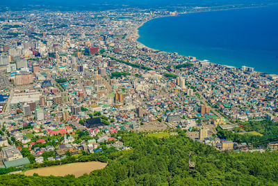 High angle view of townscape by sea