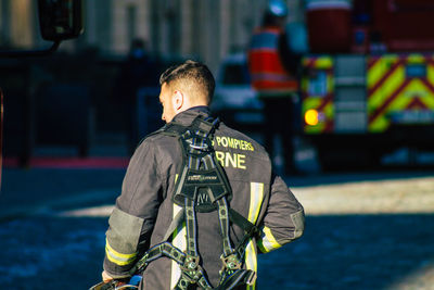 Rear view of man standing by text