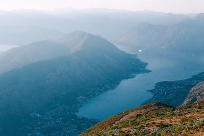 High angle view of mountain by sea against sky