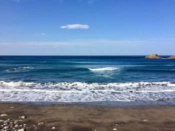 Scenic view of sea against blue sky