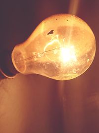 Close-up of illuminated light bulb