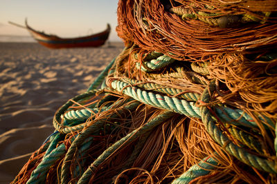 Close-up of rope on sand at beach