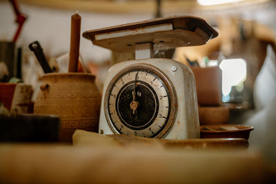 Cropped hand of person holding clock