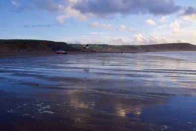 Scenic view of beach against sky