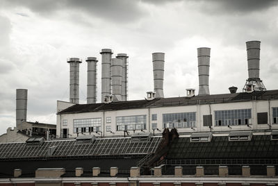 Low angle view of factory against sky