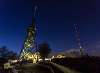 Low angle view of tower against sky at night